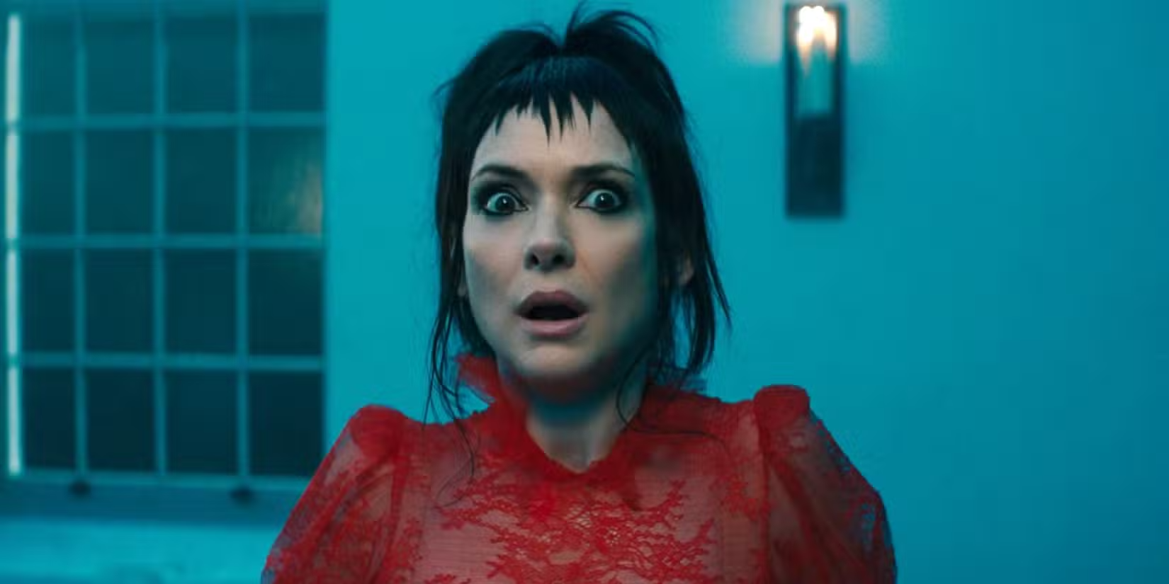 Winona ryder as lydia deetz looking shocked in beetlejuice 2 wedding scene