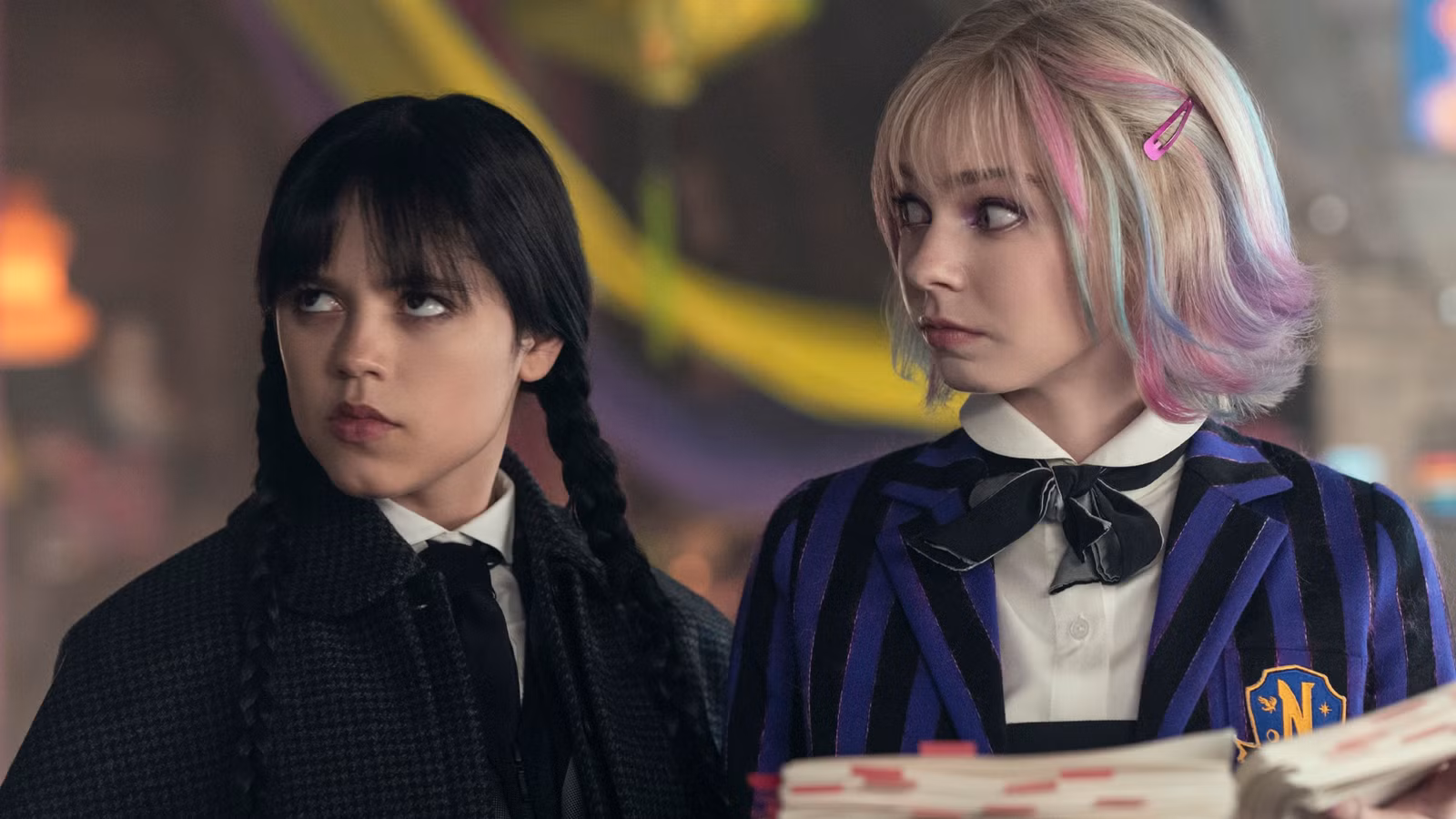 Jenna ortega as wednesday addams and emma myers as enid in wednesday season